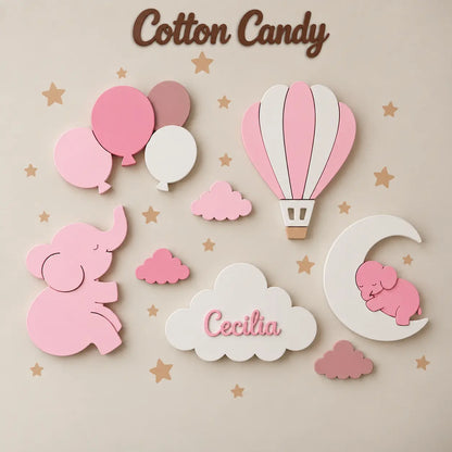 Conjunto de lámparas de pared LED infantiles con elefante, globo aerostático, globos, luna y nubes, incluyendo una nube personalizada con el nombre y tonos de rosa. Decoración cálida y acogedora para una habitación bebé. 